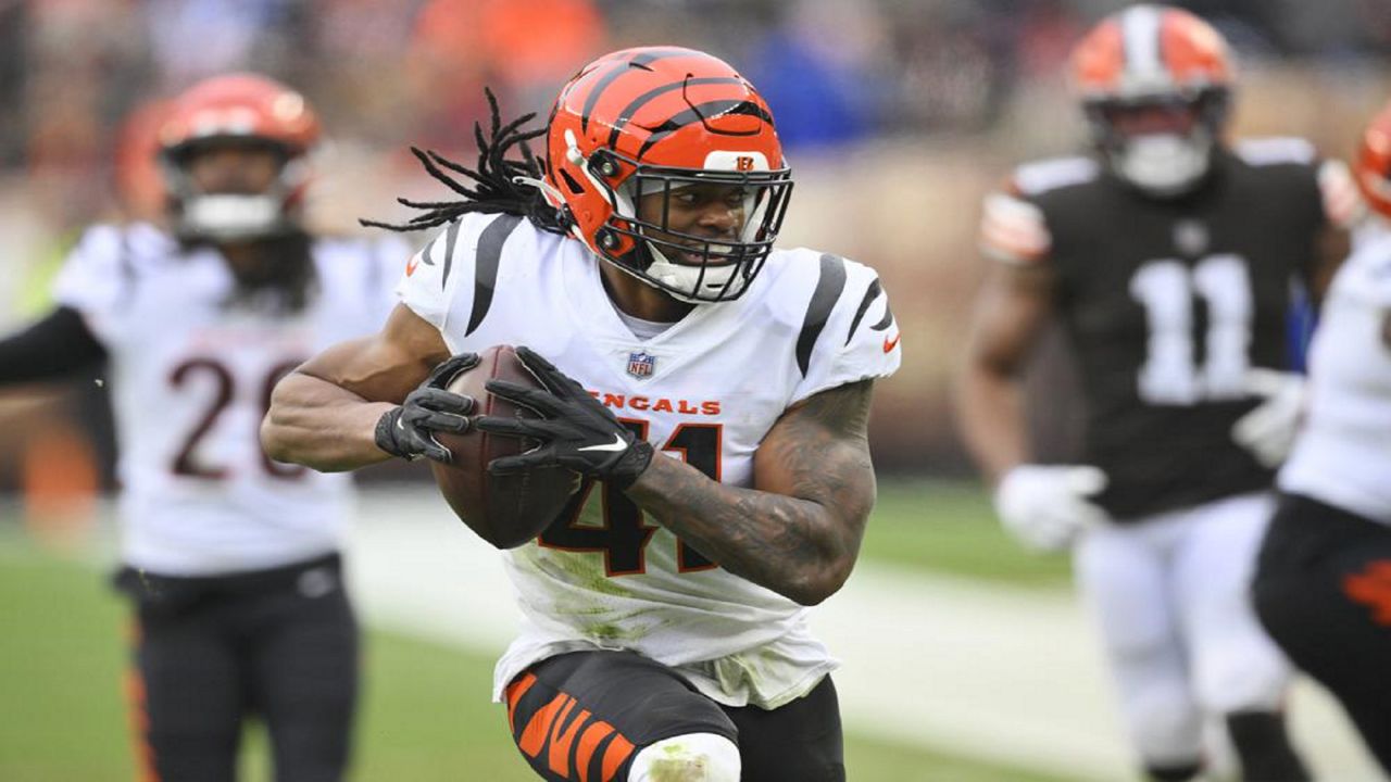 Cincinnati Bengals defensive back Trayvon Henderson (41) runs in for a touchdown during the first half of an NFL football game against the Cleveland Browns, Sunday, Jan. 9, 2022, in Cleveland. (AP Photo/David Richard)