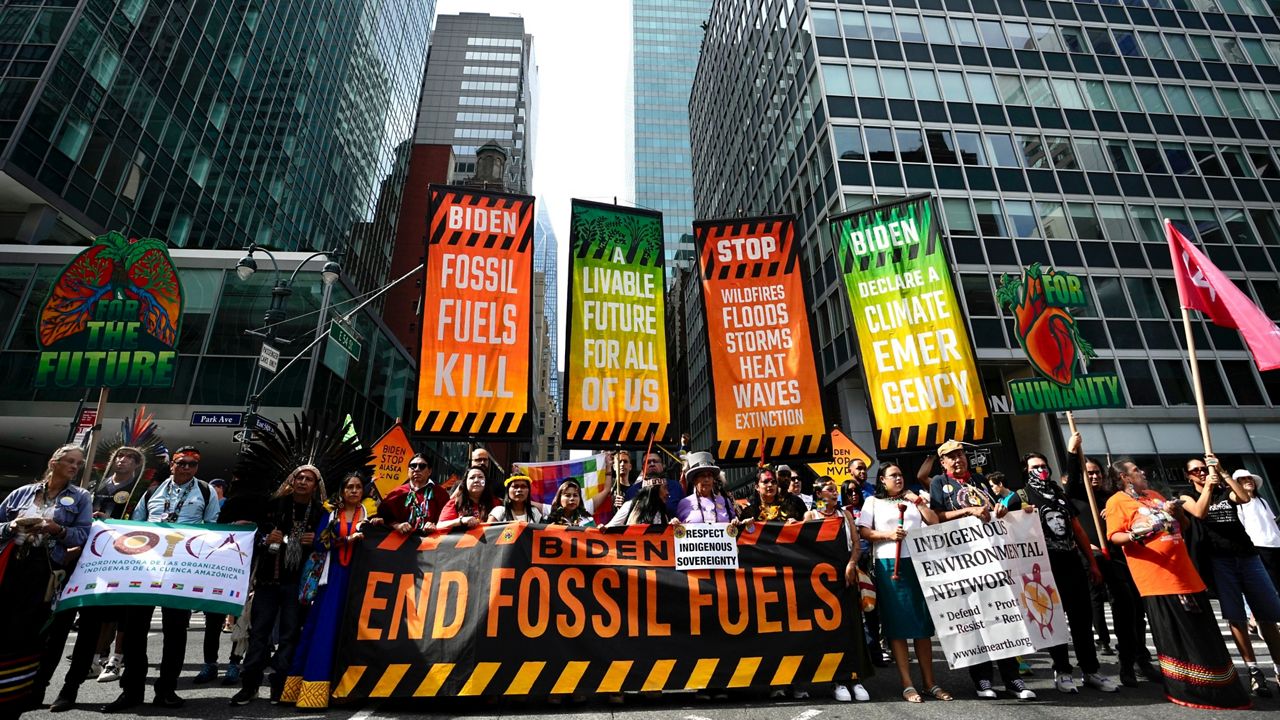 Climate activists block traffic on Park Avenue during a march protesting energy policies and the use of fossil fuels, in New York, Sunday, Sept. 17, 2023. (AP Photo / Bryan Woolston)