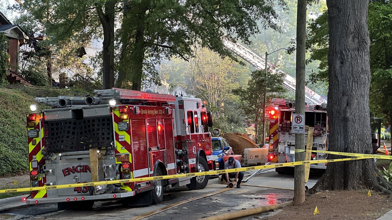 About 60 firefighters responded to an explosion Friday morning at a south Charlotte home. Officials say only one person was treated for minor injuries on the scene. (Spectrum News 1/Claudia Puente)