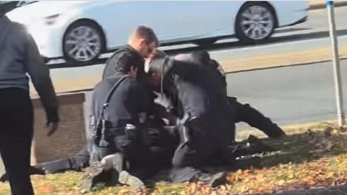 The video shows a police officer repeatedly punch a woman as she is on the ground. (Instagram/@outstandingdrew)