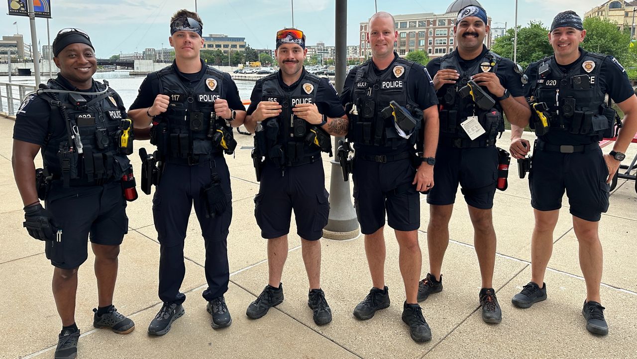 A photograph shows Charlotte-Mecklenburg Police officers providing security at the Republican National Convention Milwaukee this week wearing outer carrier vests. (Spectrum News 1/Reuben Jones)