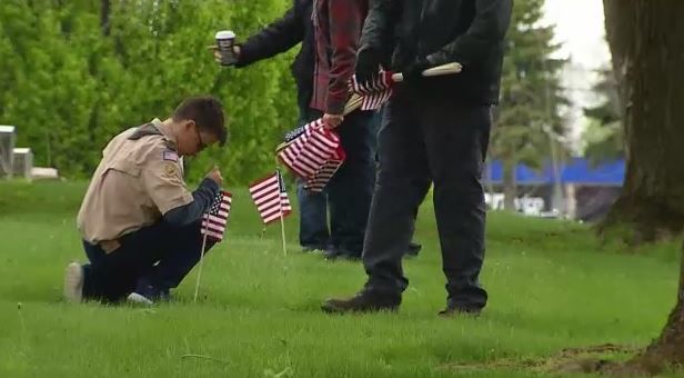 Boy Scout Troop Honors Fallen Veterans At Woodlawn Cemetery