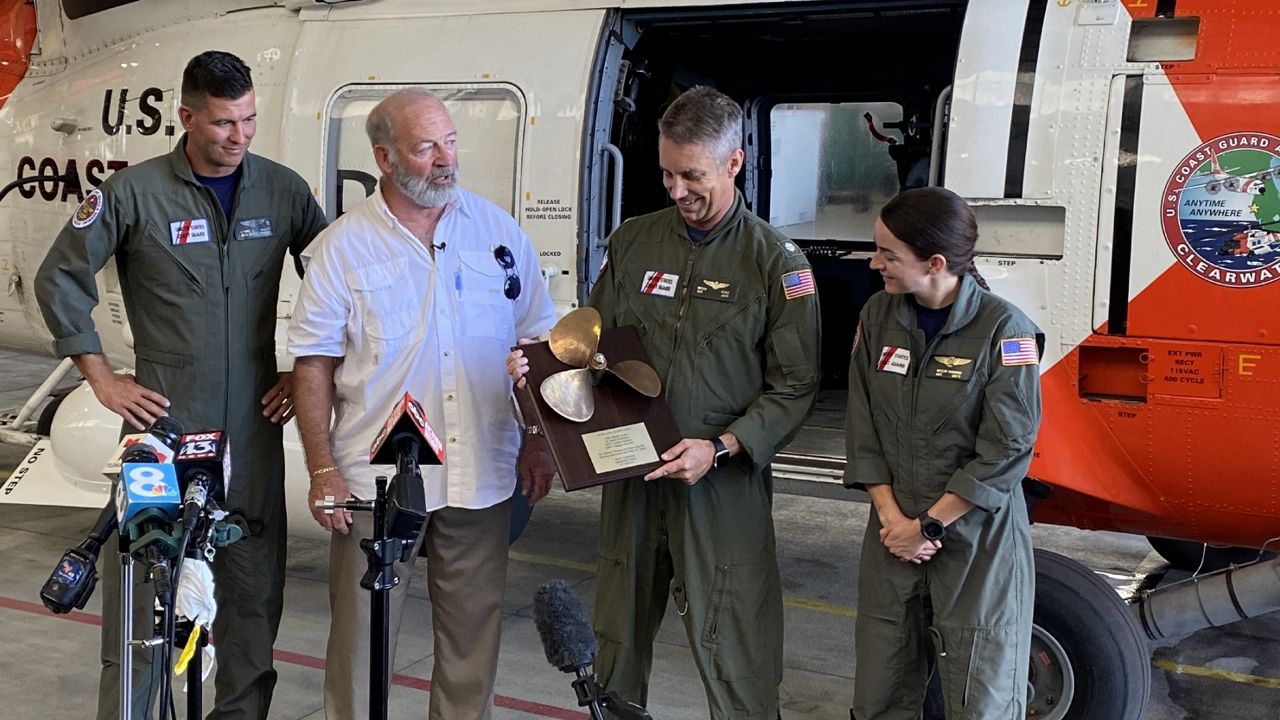 Clearwater Coast Guard reunite with man they rescued during Hurricane Ian. (Spectrum News/Josh Rojas)