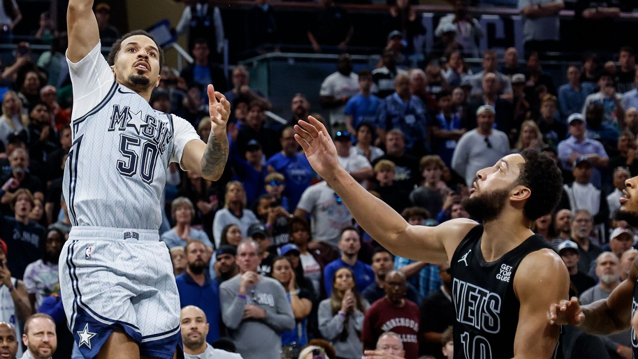 Orlando Magic guard Cole Anthony (50) hits the winning two-point shot during the second half of an NBA basketball game against the Brooklyn Nets, Sunday, Dec. 29, 2024, in Orlando, Fla. (AP Photo/Kevin Kolczynski)