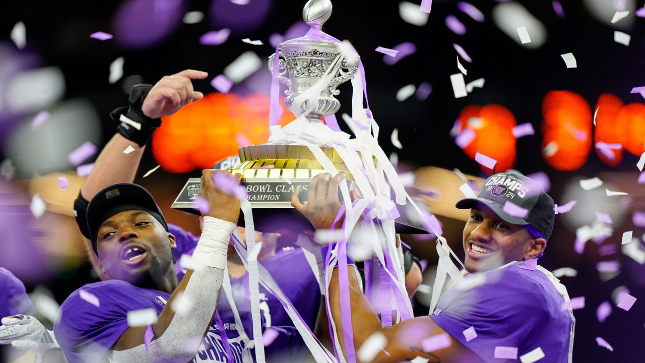 Washington linebacker Edefuan Ulofoshio (5), on the left, and quarterback Michael Penix Jr. (9), on the right, celebrate after defeating Texas during the Sugar Bowl CFP NCAA semifinal college football game, Monday, Jan. 1, 2024, in New Orleans. ESPN and the College Football Playoff have agreed to a six-year deal worth $1.3 billion annually that allows the network to keep exclusive rights to the 12-team playoff through the 2031 season, two people with knowledge of the agreement told The Associated Press, Tuesday, Feb. 13, 2024. (AP Photo/Jacob Kupferman, FGile)