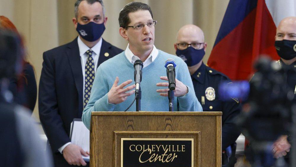 Rabbi Charlie Cytron-Walker of Congregation Beth Israel addresses reporters during a news conference at Colleyville Center on Friday, Jan. 21, 2022 in Colleyville, Texas. In the final moments of a 10-hour standoff with a gunman at a Texas synagogue, the remaining hostages and officials trying to negotiate their release took “near simultaneous plans of action,” with the hostages escaping as an FBI tactical team moved in, an official said Friday. (Elias Valverde II/The Dallas Morning News via AP)