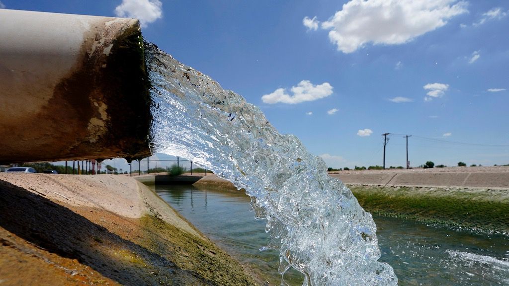 Water from the Colorado River diverted through the Central Arizona Project fills an irrigation canal, Thursday, Aug. 18, 2022, in Maricopa, Ariz. (AP Photo/Matt York, File)