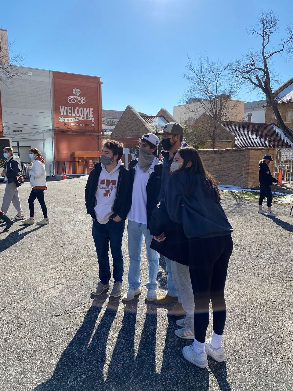 Students pose for a picture on the campus of University of Texas at Austin in this image from February 20, 2021. (Travis Recek/Spectrum News 1)
