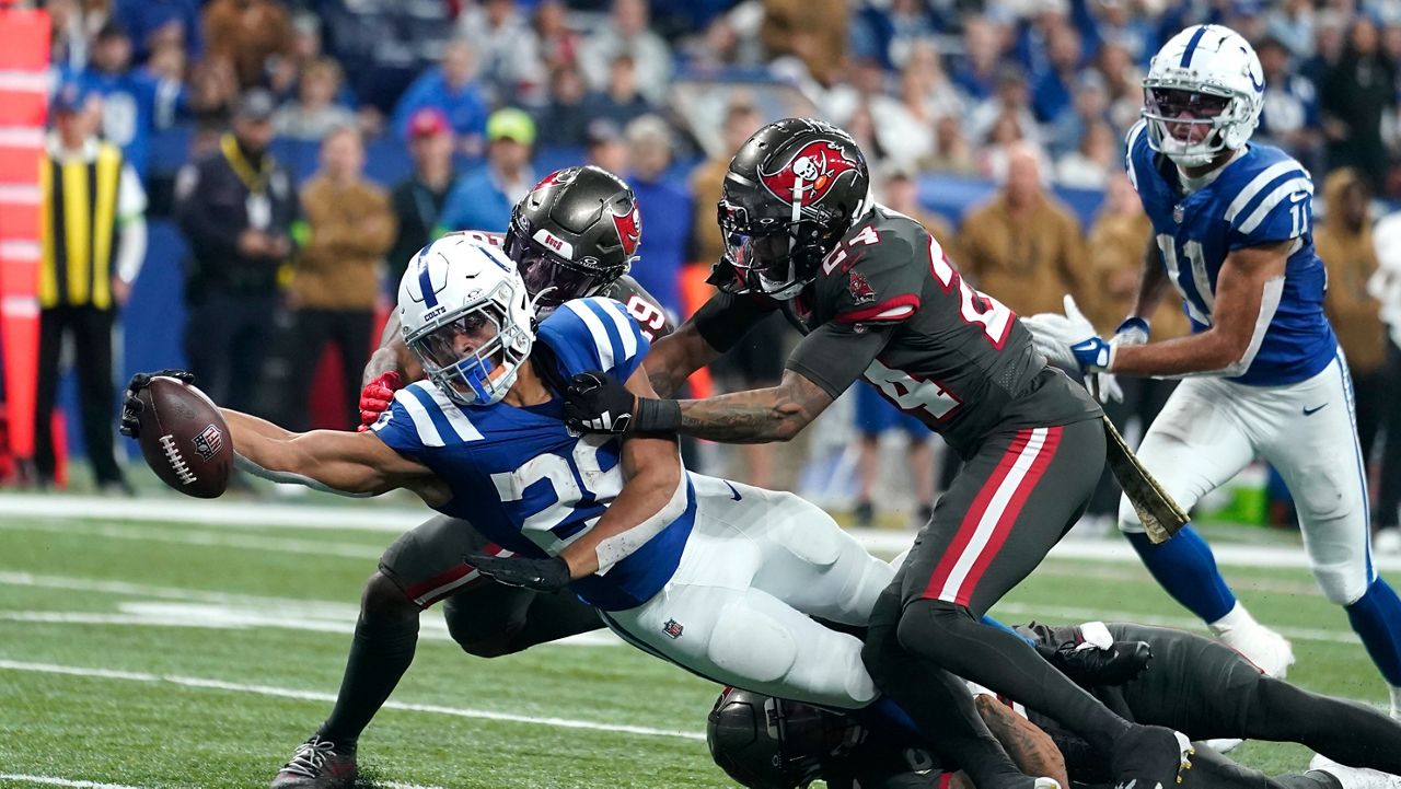 Indianapolis Colts running back Jonathan Taylor (28) reaches for a touchdown during the second half of an NFL football game against the Tampa Bay Buccaneers Sunday, Nov. 26, 2023, in Indianapolis. (AP Photo/Darron Cummings)