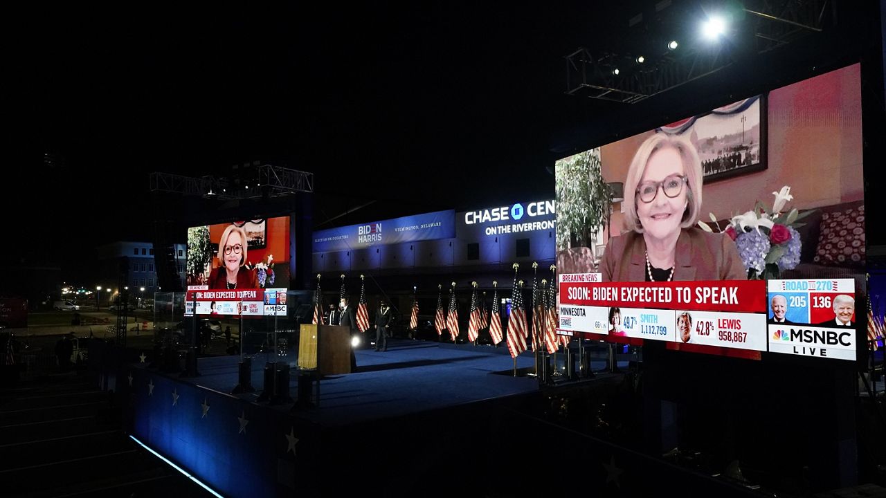 MSNBC election coverage is displayed on screen as supporters wait for Joe Biden, then a presidential candidate, to speak early Nov. 4, 2020, in Wilmington, Del. (AP Photo/Andrew Harnik, File)