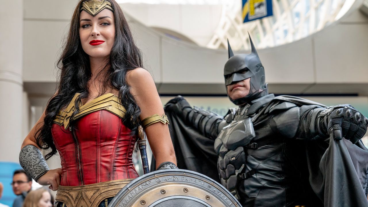 Jessica Davis and Armando Abarca from Los Angeles, CA dressed as Wonder Woman and Batman pose on day one of Comic-Con International on Thursday, July 19, 2018 (Photo by Christy Radecic/Invision/AP)