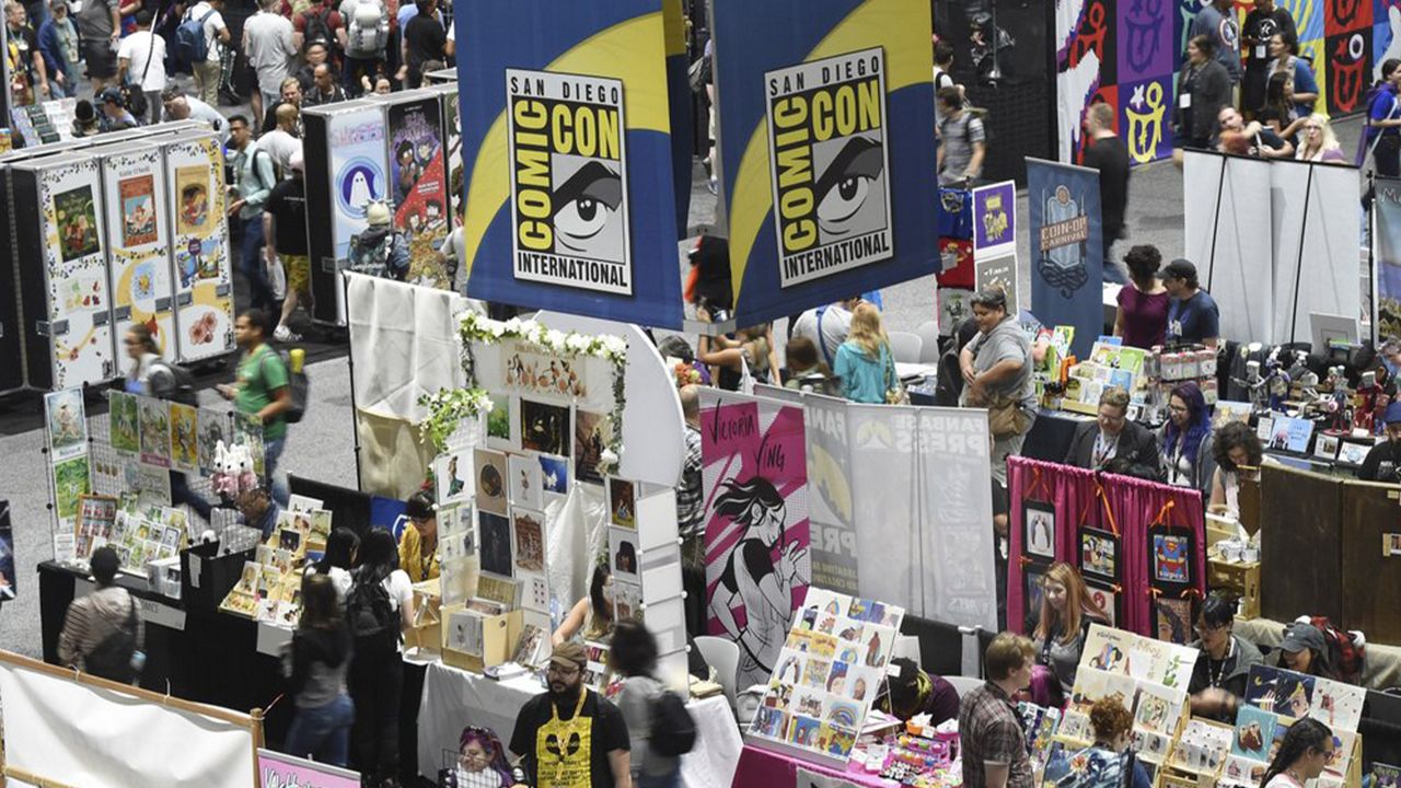 Comic-Con attendees walk the convention center floor during preview night at Comic-Con International on July 17, 2019, in San Diego, Calif. The convention will remain virtual for the July event, but organizers are planning for a smaller-scale gathering later this year. Comic-Con announced Monday, March 1, 2021, that the annual confab will return to virtual for a second-straight year between July 23-25. (Photo by Chris Pizzello/Invision/AP, File)