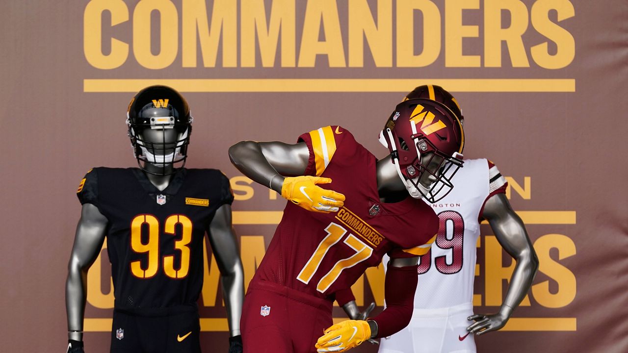 Washington's NFL franchise unveils its new name, the Commanders, and uniforms Wednesday in Landover, Md. (AP Photo/Patrick Semansky)