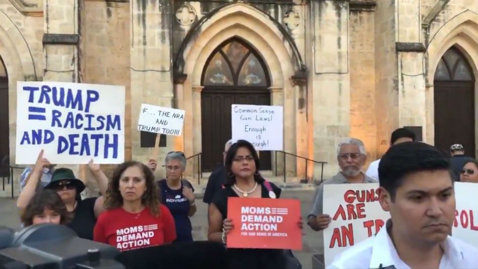 San Antonio residents gathering for vigil remembering the victims of the El Paso and Dayton mass shootings. (Spectrum News)