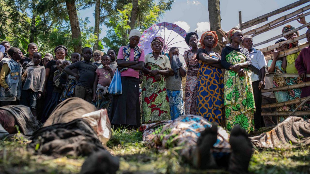 Relatives gather to identify victims in the village of Nyamukubi in Congo on Saturday, May 6, 2023.