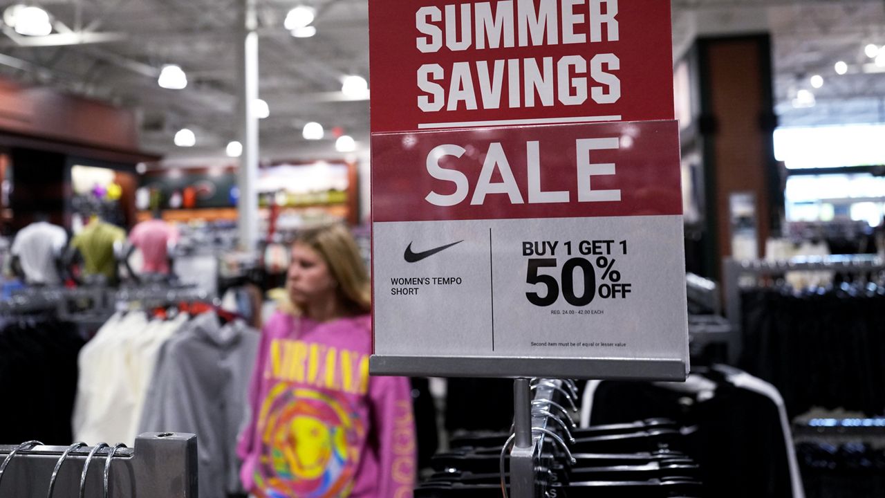 A sale sign is displayed for clothes Monday at a retail store in Vernon Hills, Ill. (AP Photo/Nam Y. Huh)