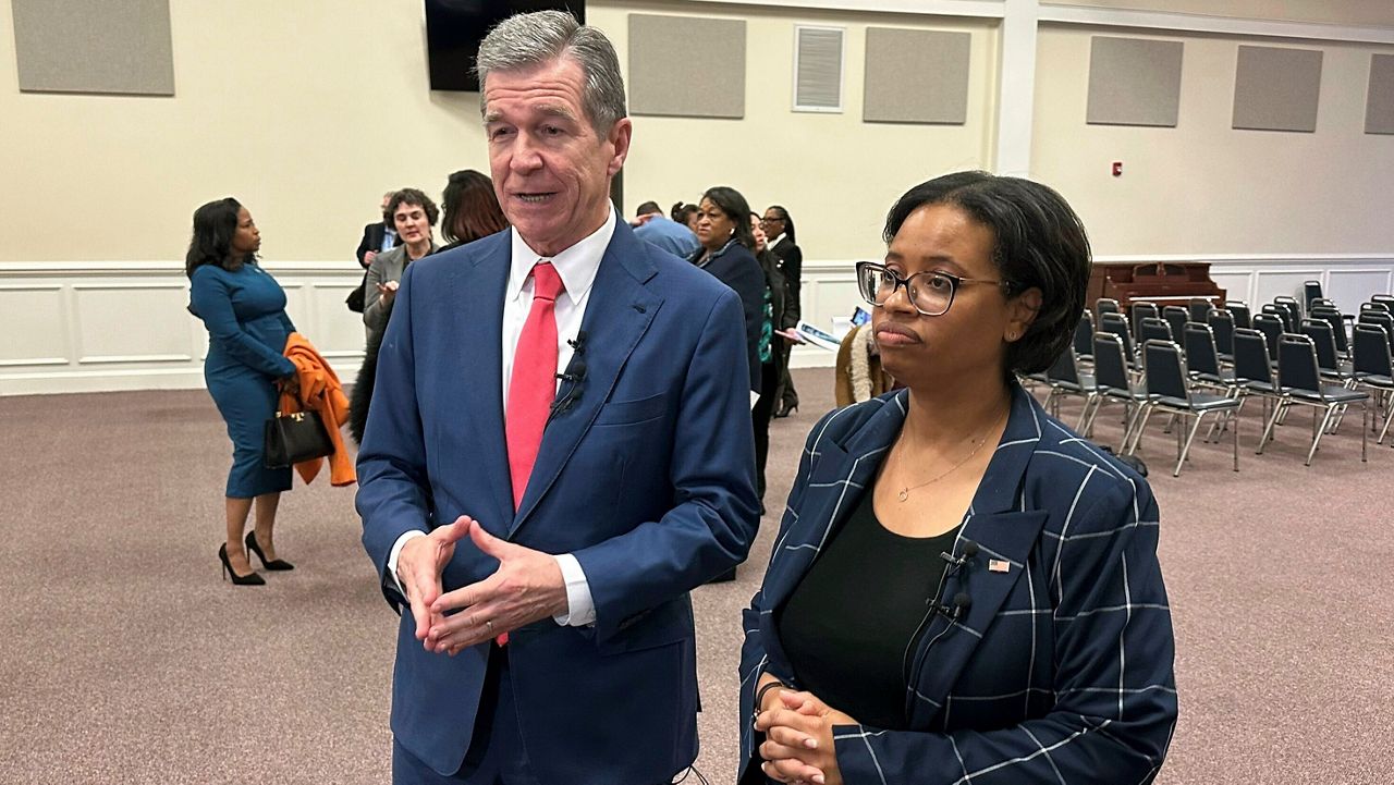 Gov. Roy Cooper, left, and Centers for Medicare & Medicaid Services administrator Chiquita Brooks-LaSure speak to reporters after an event at Martin Street Baptist Church in Raleigh, N.C., on Wednesday, Jan. 10, 2024. (AP Photo/Gary D. Robertson)