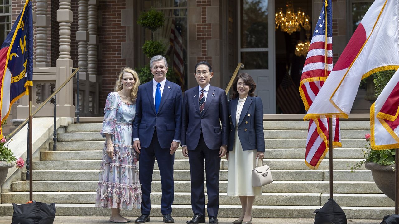 North Carolina first lady Kristin Cooper, North Carolina Gov. Roy Copper, Japan Prime Minister Fumio Kishida and Japan first lady Yuko Kishida pose for a photograph before attending a luncheon at the North Carolina Executive Mansion, Friday, April 12, 2024, in Raleigh, N.C. (Robert Willett/The News & Observer via AP, Pool)