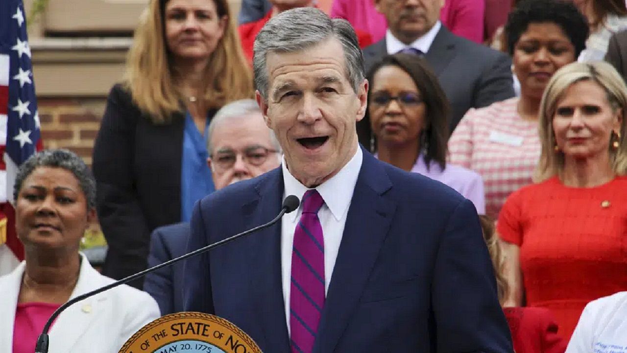 North Carolina Democratic Gov. Roy Cooper speaks Monday, March 27, 2023, outside the Executive Mansion in Raleigh, N.C., before signing a Medicaid expansion law that was a decade in the making. (AP Photo/Hannah Schoenbaum)
