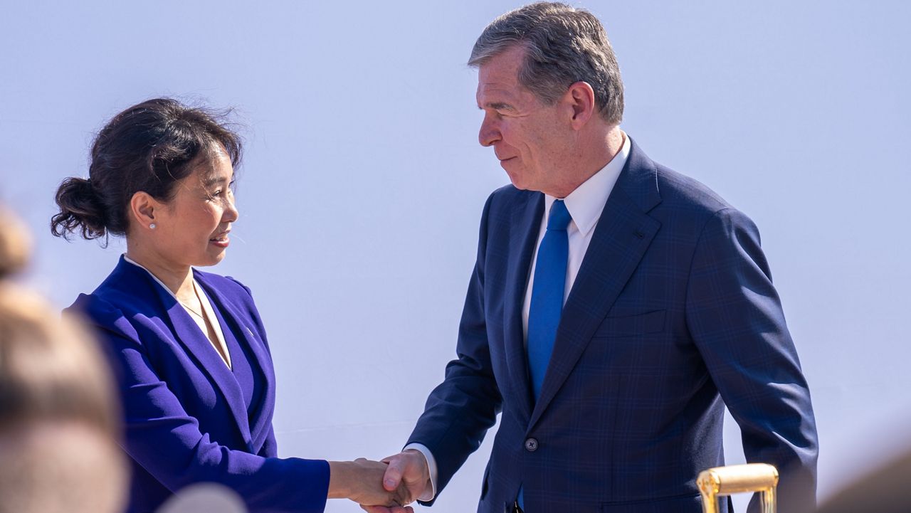 VinFast chief executive Le Thi Thu Thuy, left, and Gov. Roy Cooper attend a groundbreaking Friday, July 28, 2023, at the future site of the Vietnamese carmaker’s electric vehicle plant in Moncure, N.C. (N.C. Governor’s Office)