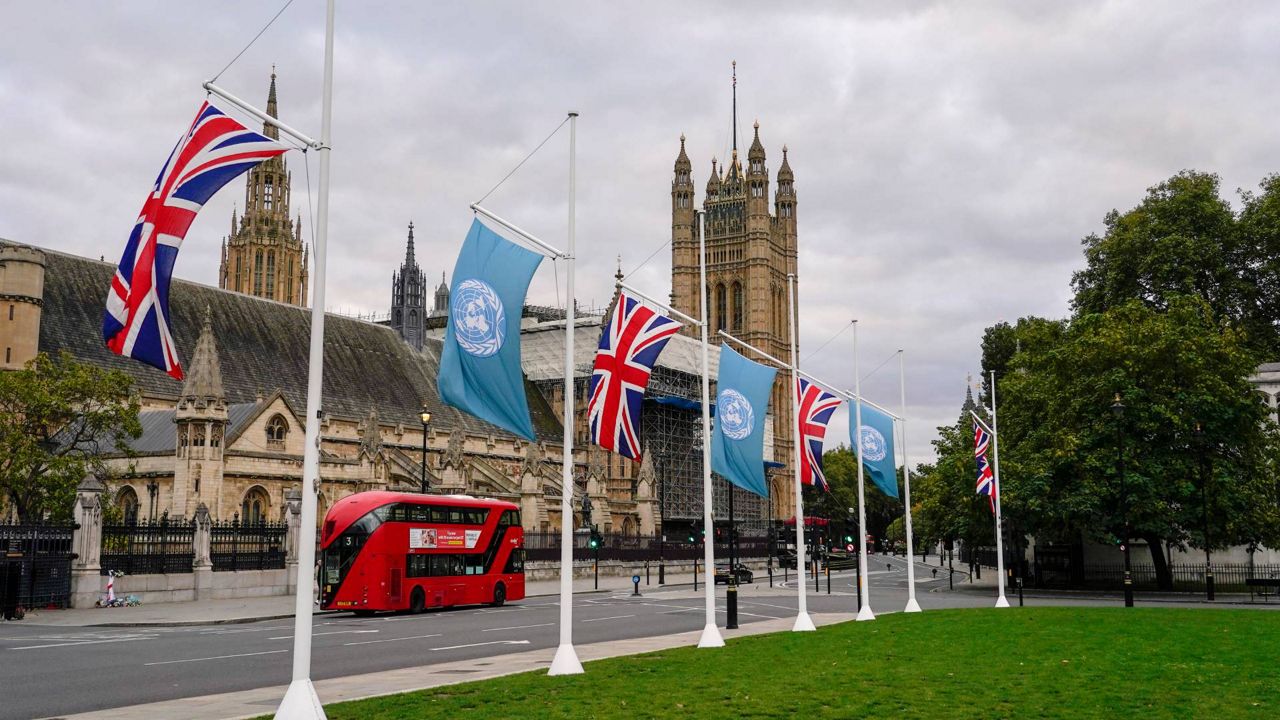 British and U.N. flags fly in Parliament Square, in London, Sunday, Oct. 24, 2021, ahead of the UN climate conference COP26 that will be held in Glasgow, Scotland, next week. (AP Photo/Alberto Pezzali)