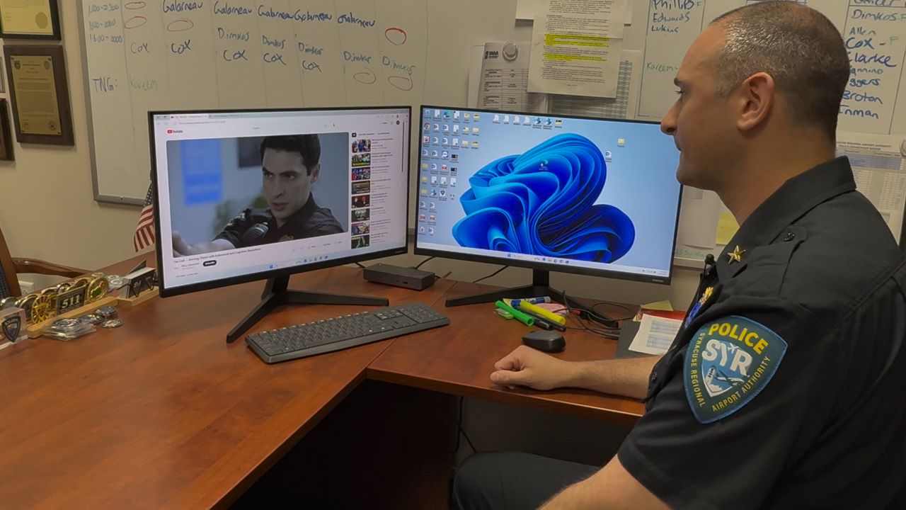 The Syracuse Regional Airport Authority Police Department Chief watching a training video from the COPS Training Portal. (Melissa Krull/Spectrum News 1 )