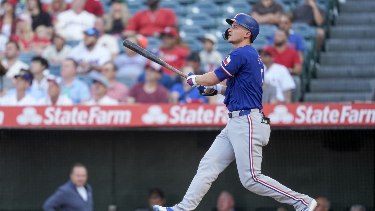 Texas Rangers' Corey Seager watches his two-run home run during the first inning of a baseball game against the Los Angeles Angels, Monday, July 8, 2024, in Anaheim, Calif. (AP Photo/Ryan Sun)