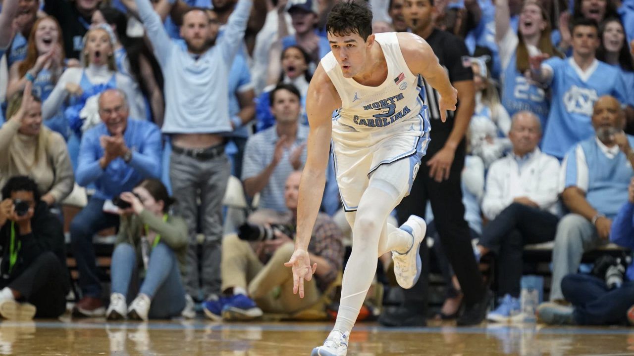 North Carolina guard Cormac Ryan (3) celebrates after making a 3-point basket against Radford during the second half of an NCAA college basketball game in Chapel Hill, N.C., Monday, Nov. 6, 2023. (AP Photo/Chuck Burton)