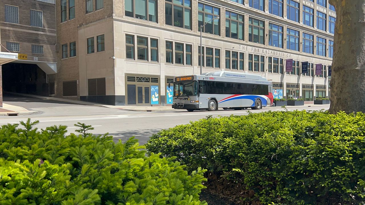 A bus, part of the Central Ohio Transit Authority (COTA), drives on South Front Street in Columbus, Ohio on Monday, April 22, 2024. (Spectrum News 1/AJ Hymiller)