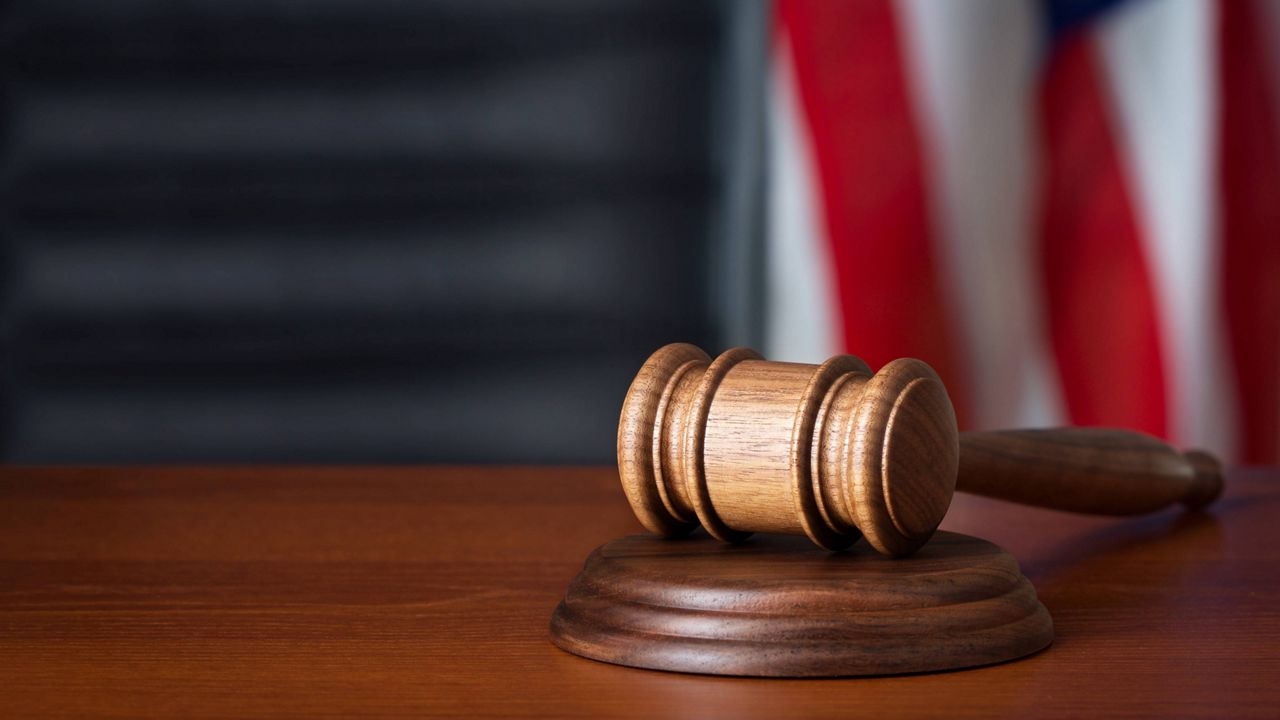 A gavel sits on a desk.