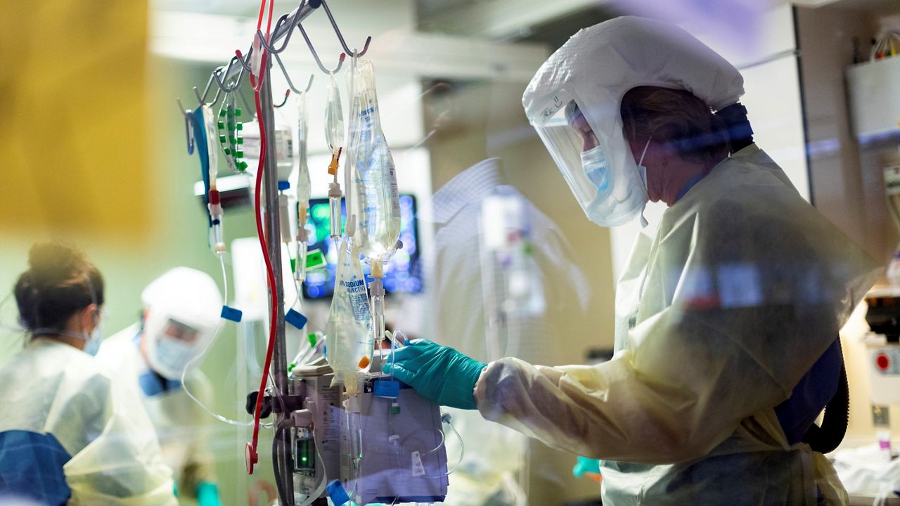 Nurse Jack Kingsley attends to a COVID-19 patient in the intensive care unit on Aug. 31 at St. Luke's Boise Medical Center in Boise, Idaho. (AP Photo/Kyle Green)