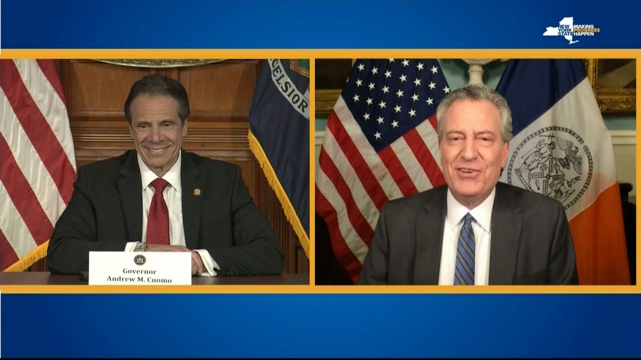 mayor deblasio and governor cuomo on split-screen TV