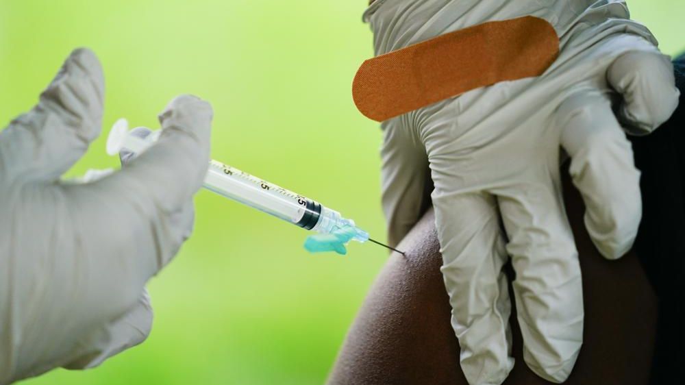 A health worker administers a dose of COVID-19 vaccine during a vaccination clinic in Reading, Pa. (AP Photo/Matt Rourke, File)