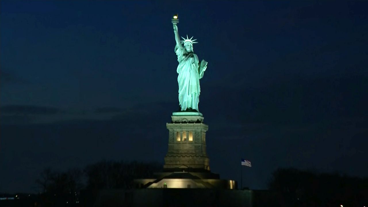 Families Who Lost Loved Ones to COVID19 React to Memorial