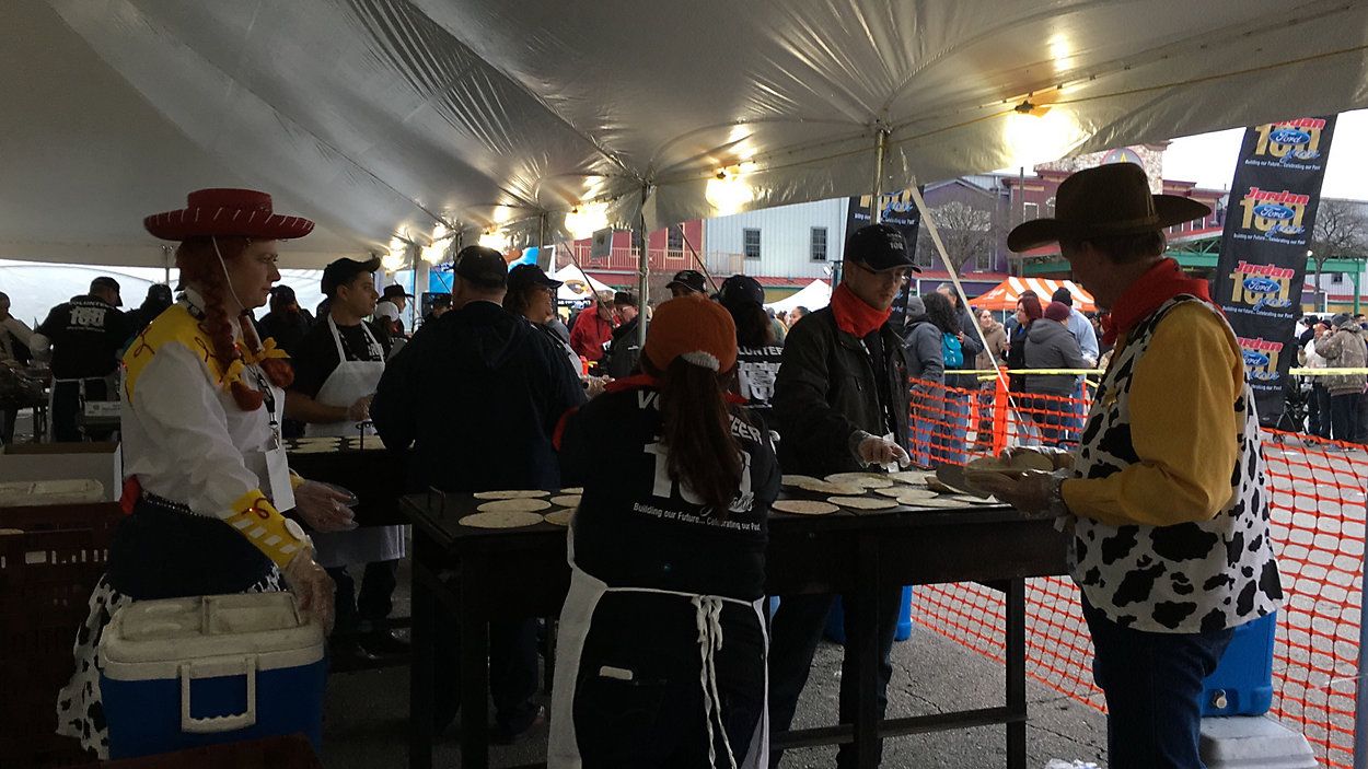 San Antonio Cowboy Breakfast as volunteers prepare breakfast tacos. (Spectrum News 1)