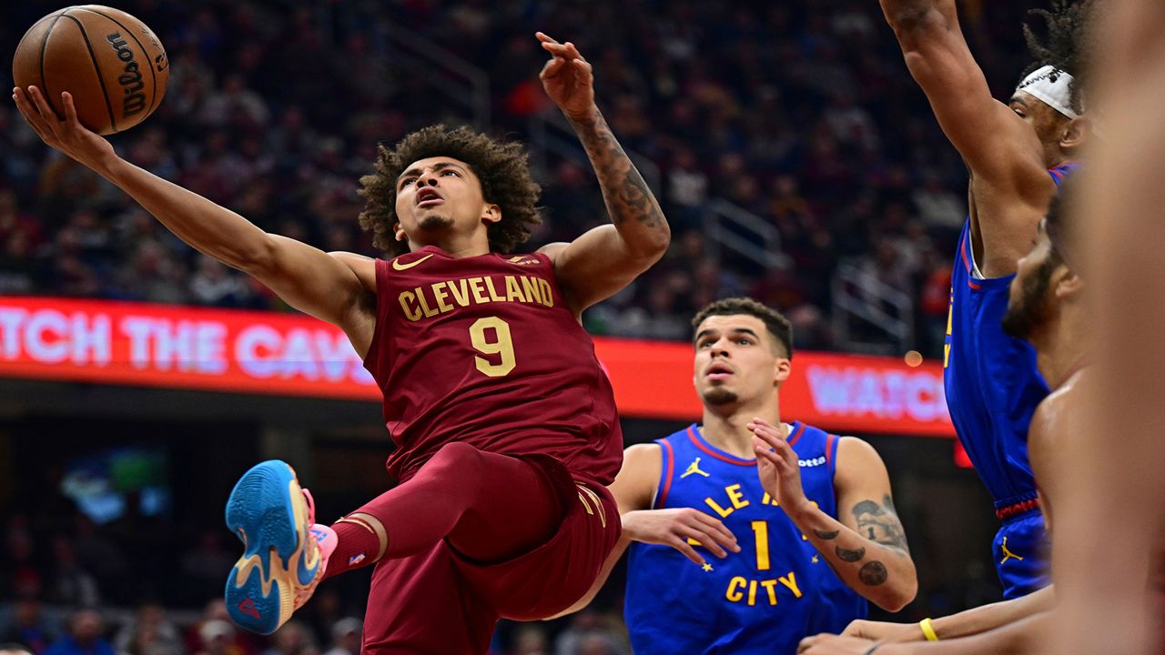 Cleveland Cavaliers guard Craig Porter goes to the basket against Denver Nuggets forward Michael Porter Jr. in the first half of an NBA basketball game, Sunday, Nov. 19, 2023, in Cleveland. (AP Photo/David Dermer, File)