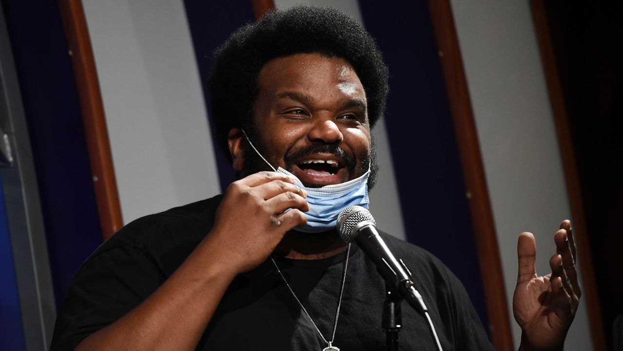 In this April 20, 2020, photo, comedian Craig Robinson performs at the Laugh Factory comedy club in Los Angeles. A man fired a gun inside a comedy club in Charlotte on Saturday night, July 16, 2022 shortly before Robinson was set to perform, police said. (AP Photo/Chris Pizzello, file)
