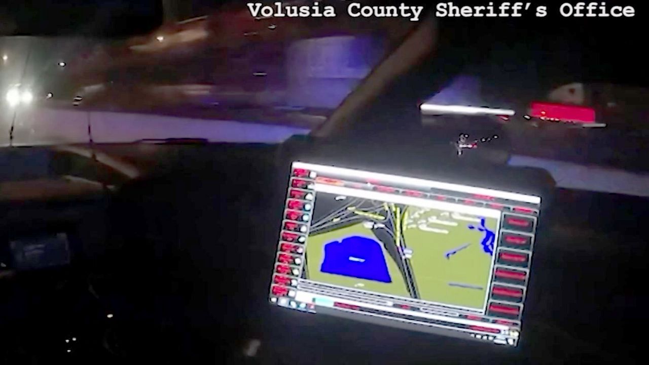 A Volusia County Sheriff's deputy responds to the scene of a wrong-way crash on I-95 near Daytona Beach that killed three people and injured two Tuesday night. (Photo courtesy of VCSO)