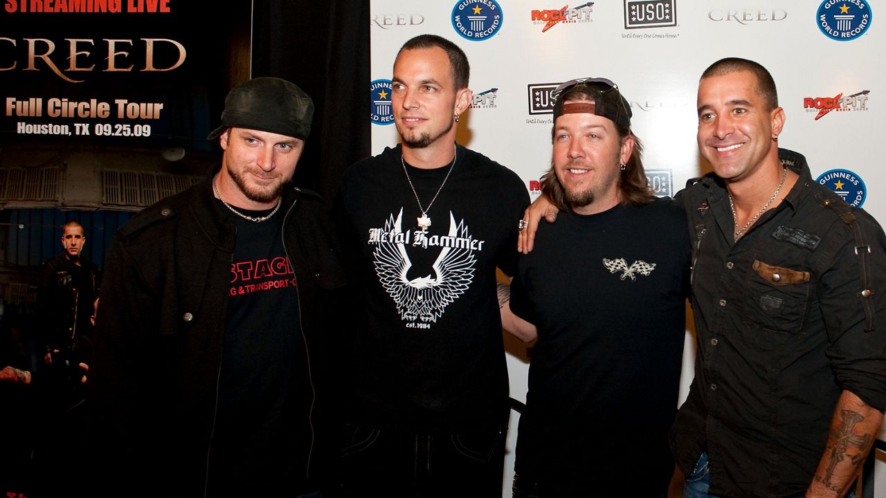 Creed bassist Brian Marshall, guitarist Mark Tremonti, drummer Scott Phillips and lead singer Scott Stapp pose during a press conference before the band's show Friday, Sept. 25, 2009 in Houston. ROCKPIT.com has aligned with the USO to bring the concert to troops overseas by streaming the show shot with a record breaking 239 cameras. (Dave Einsel / AP Images for ROCKPIT)