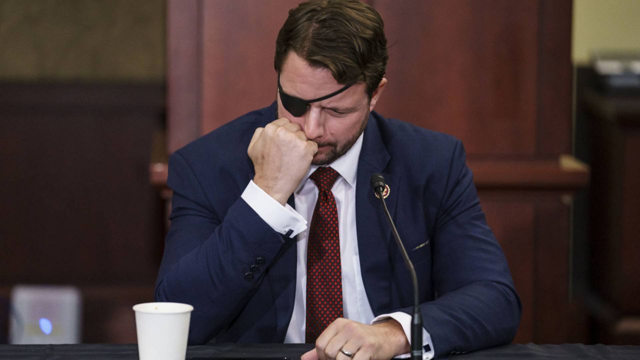 U.S. Rep. Dan Crenshaw, R-Texas, during a roundtable discussion at the Capitol in Washington, Monday, Aug. 30, 2021. (AP Photo/J. Scott Applewhite)