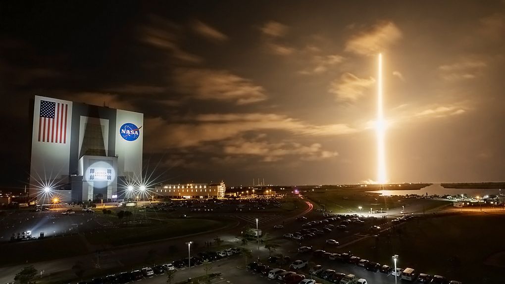 With a view of the iconic Vehicle Assembly Building at left, a SpaceX Falcon 9 rocket soars upward from Launch Complex 39A at NASA’s Kennedy Space Center in Florida on April 23, 2021, carrying the company’s Crew Dragon Endeavour capsule on NASA’s SpaceX Crew-2 mission. Launch time was at 5:49 a.m. EDT. (NASA/Ben Smegelsky)