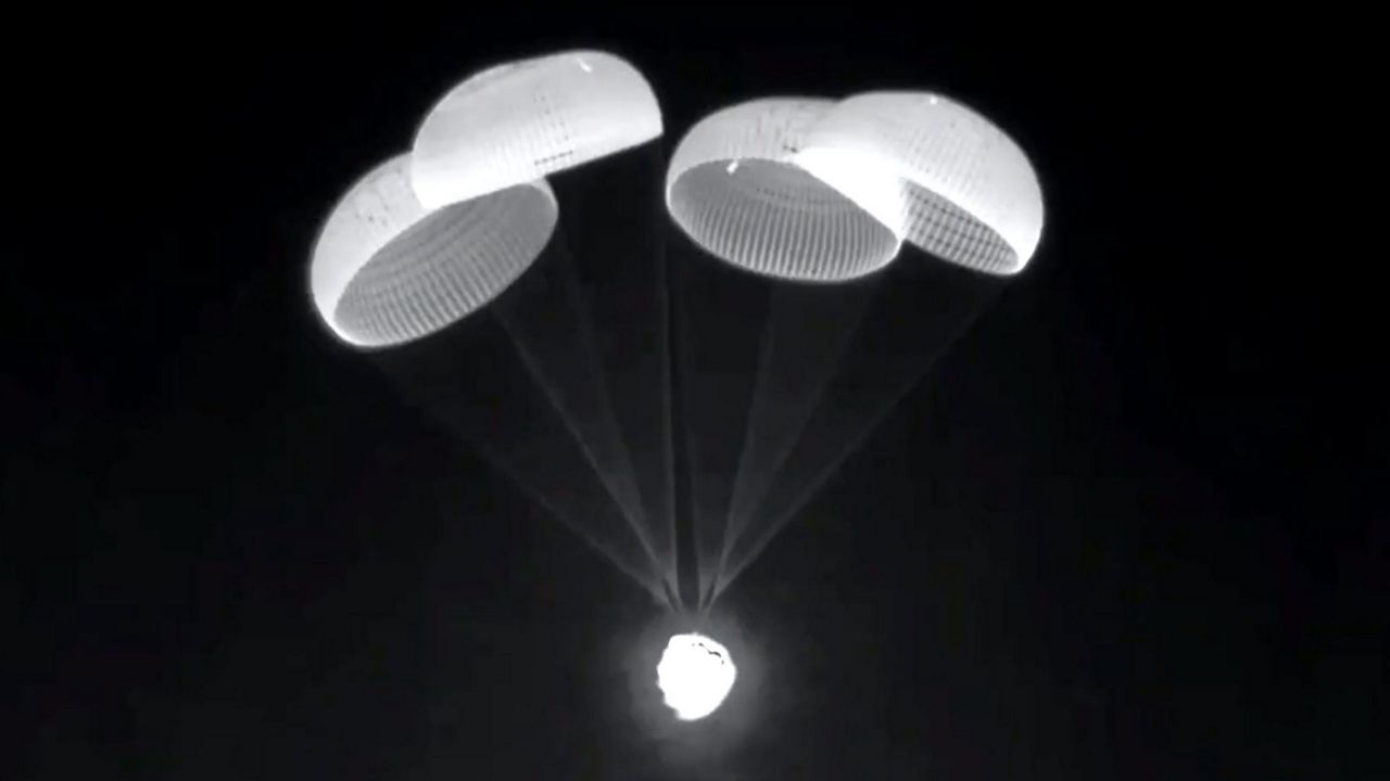 Seen in infrared, the four main parachutes of SpaceX's Crew Dragon Endeavour deploy Monday night over the Gulf of Mexico, moments before the spacecraft splashed down safely. (Courtesy of NASA)