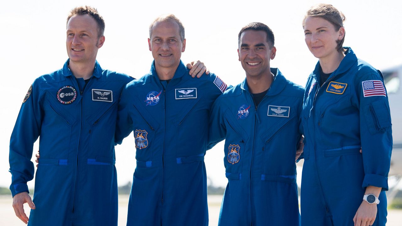 NASA astronauts Tom Marshburn, left, Raja Chari, second from left, Kayla Barron, second from right, and ESA (European Space Agency) astronaut Matthias Maurer, right, are seen as they depart the Landing Facility at NASA’s Kennedy Space Center ahead of SpaceX’s Crew-3 mission, Tuesday, Oct. 26, 2021, in Florida. (NASA/Joel Kowsky)