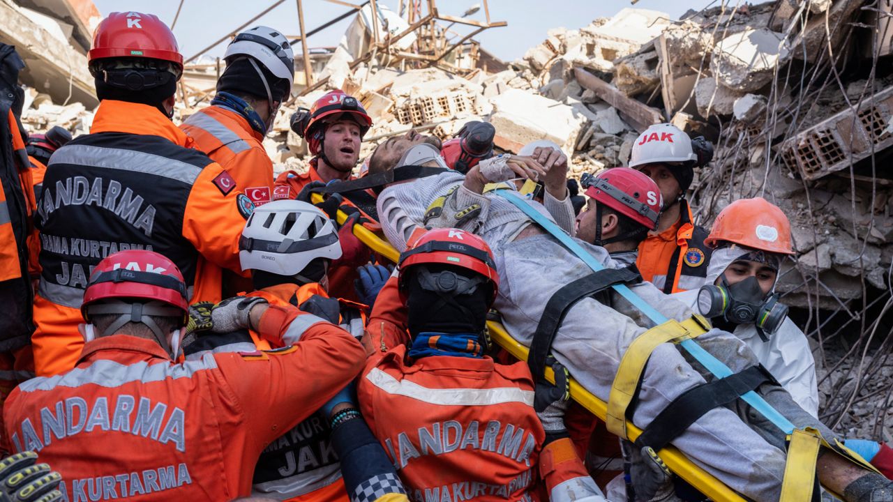 Huseyin Seferoglu, 23, is pulled from the rubble of a collapsed building in Antakya on Sunday, Feb. 12, 2023.