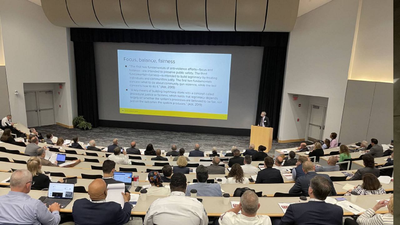 Thomas Abt, Founding Director for the Violence Reduction Center at the University of Maryland, addresses a gathering of municipal leaders from across the St. Louis region at a crime summit held at Washington University's Eric P. Newman Education Center on May 17, 2023 in St. Louis, Mo. (Spectrum News/Gregg Palermo)