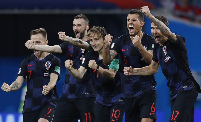 Croatia national soccer team players celebrate after a penalty is saved in a shootout during the quarterfinal match between Russia and Croatia at the 2018 soccer World Cup in the Fisht Stadium, in Sochi, Russia, Saturday, July 7, 2018. Croatia won the match 4-3 on penalties after the game ended 2-2 after extra time. (AP Photo/Manu Fernandez)