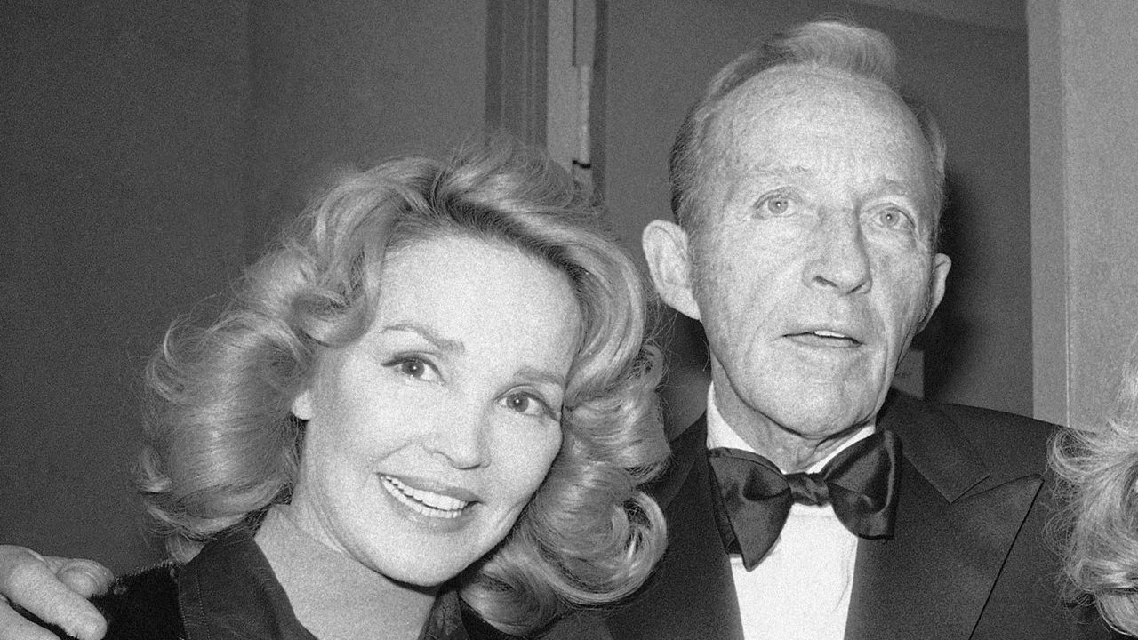 Bing Crosby stands with his wife, Kathryn, left in New York on Dec. 8, 1976. (AP Photo/Carlos Rene Perez)