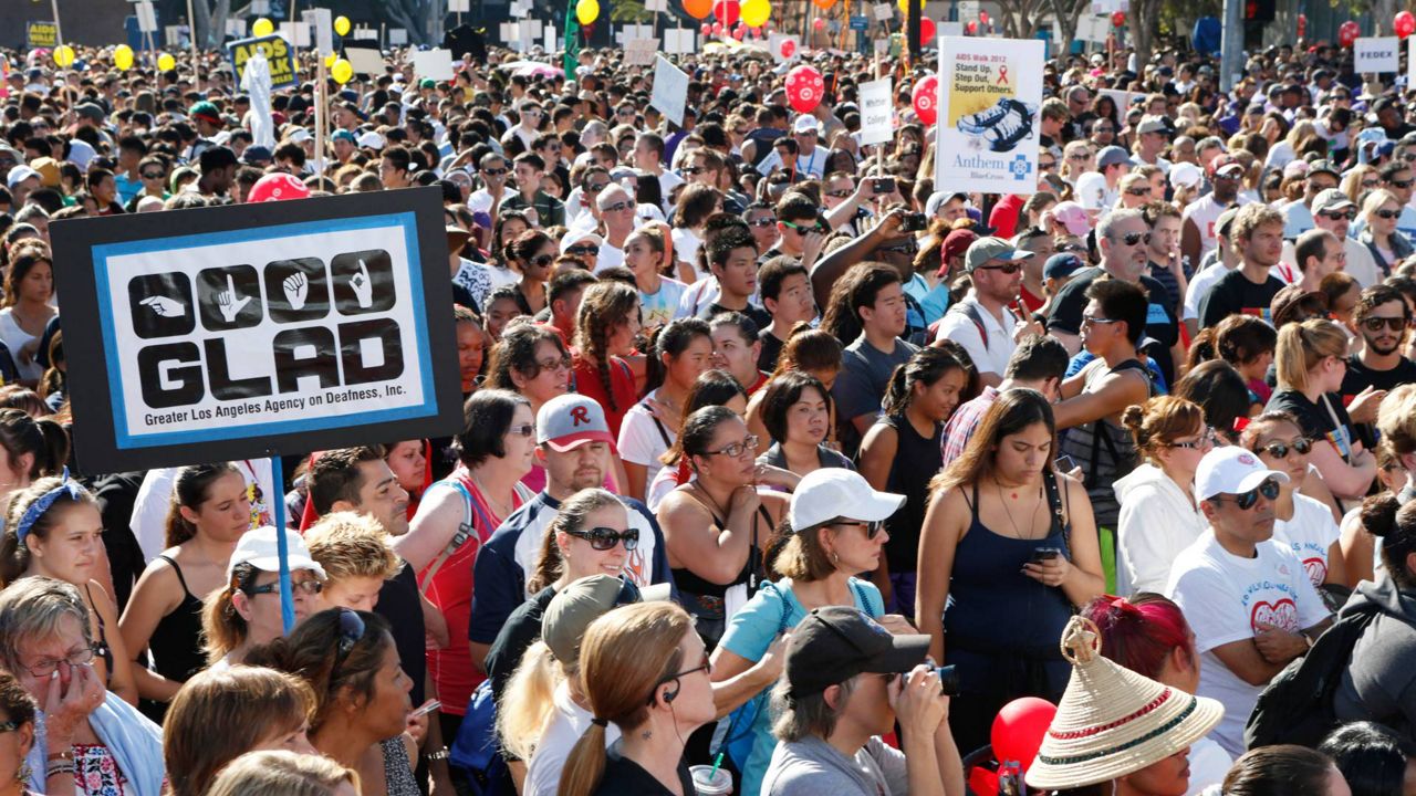 Crowd participates in AIDS Walk LA on Oct. 14, 2012, in Los Angeles. (Photo by Todd Williamson/Invision/AP)