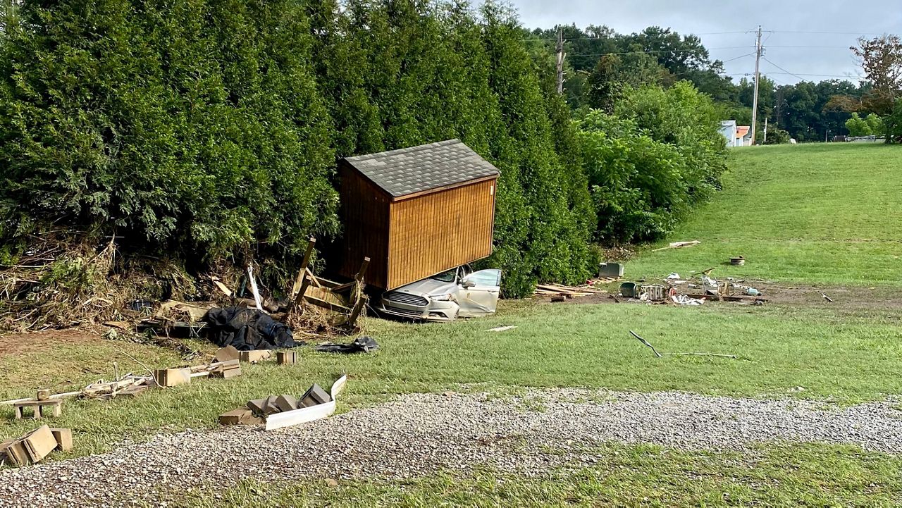 Search and rescue effots continue for two people still missing after flash floods from Tropical Depression Fred drenched western North Carolina.