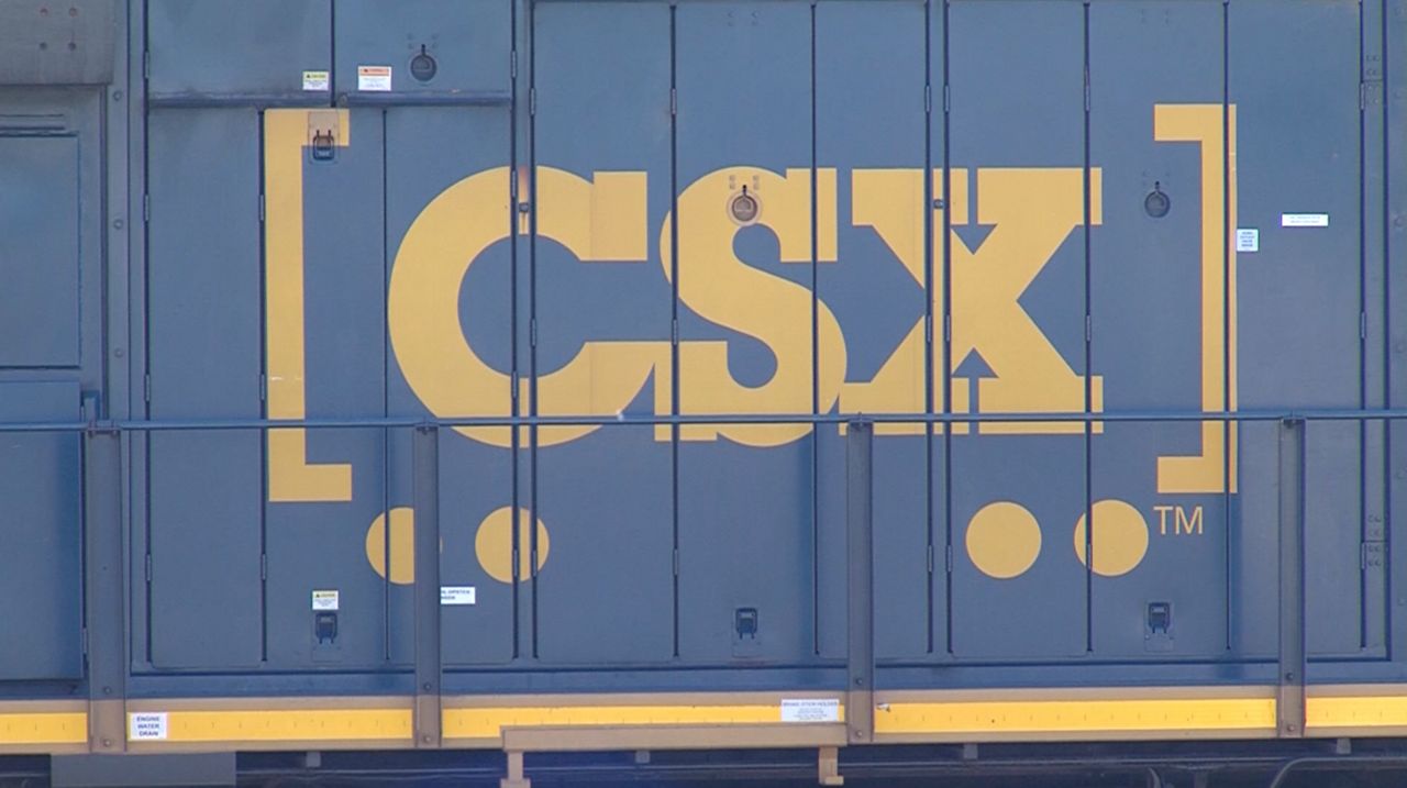 The CSX logo on the side of a train. (Spectrum News 1/Shaun Grady)